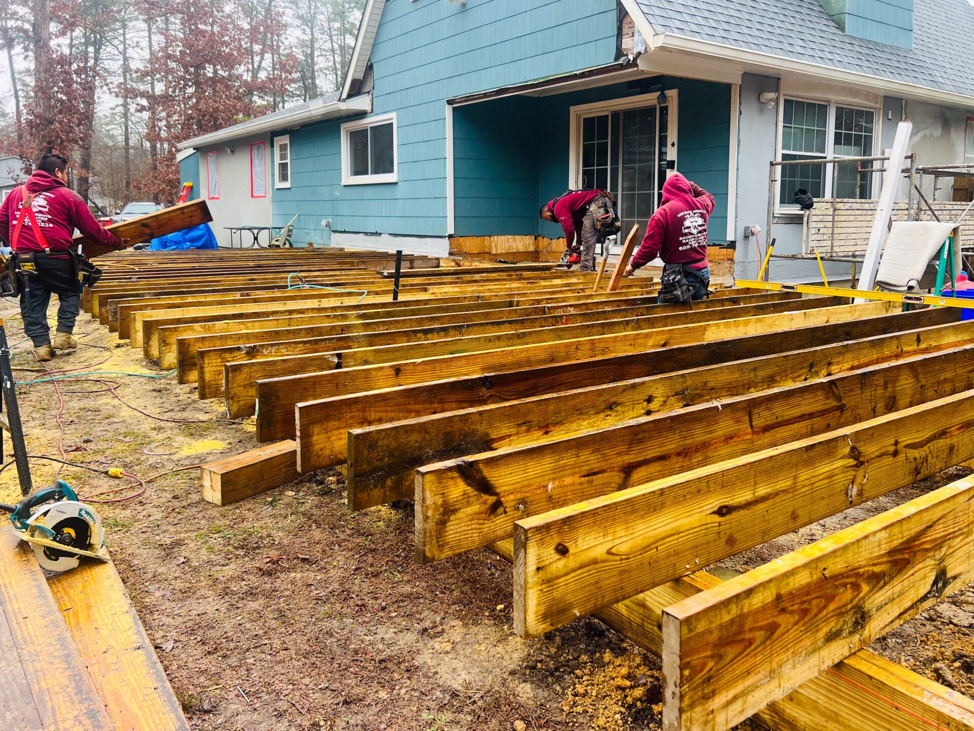 ml roofing and siding carpenters ready to build a deck